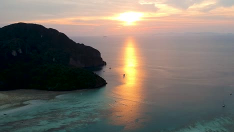 Aerial-of-stunning-sunset-on-tropical-island-of-Koh-Phi-Phi-island-viewpoint,-Thailand