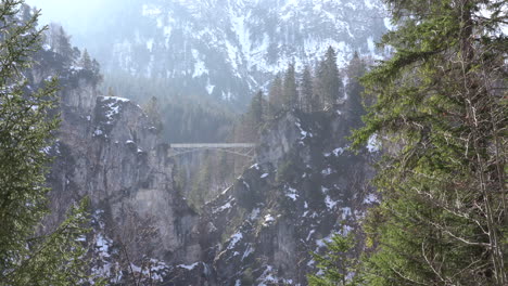 Aerial-winter-view-of-Neuschwanstein-Queen-Mary-Marienbrucke-Bridge-4k-video