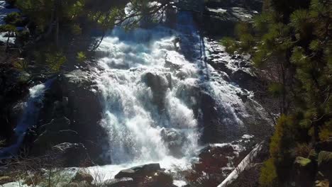 Aerial-shot,-Eagle-Falls,-Lake-Tahoe-rising-up-the-waterfalls,-California,-USA