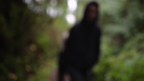 Out-of-focus-figure-in-Oregon-woods