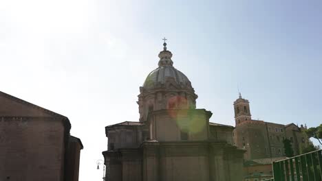 handheld-shot-for-Santa-Maria-in-Ara-Coeli-dome-seen-from-roman-forum-area,-Rome