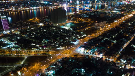Aerial-Hyper-Lapse-Orbit-Around-Traffic-Circle-at-Rush-Hour-at-Night---Light-Trails-and-City-Lights-of-Da-Nang