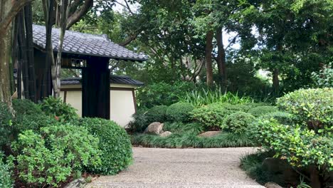 Japanese-hut-sits-in-tranquil-garden