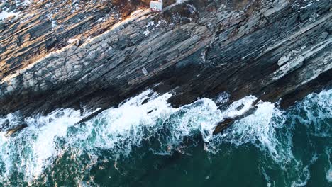 Extreme-aerial-view-by-the-rocks-in-Curtis-island-lighthouse-Camden-Maine-USA