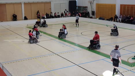 Handicap-sports,-floorball-hockey-played-indoors-in-gymnasium-hall