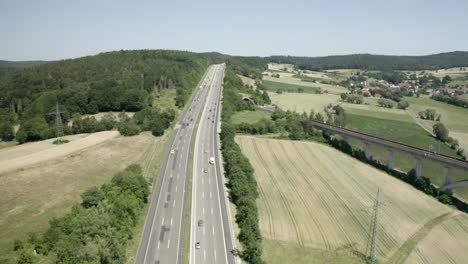 Drone-Shot-of-summer-holiday-traffic-on-the-German-Motorway-A7-in-sunlight,-Germany,-Europe