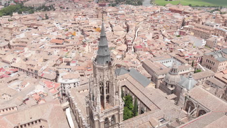 Aerial-view-spinning-around-Toledo-Cathedral,-Toledo,-Spain