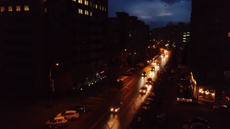 Wide-aerial-shot-of-city-street-at-night-time