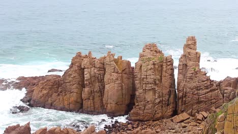 A-shot-of-the-wild-ocean-of-Cape-Woolamai-Victoria-Australia-with-the-rugged-cliffs-of-the-pinnacles