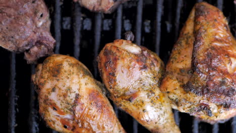 Drumstick-chicken-legs-and-lamb-chops-on-a-barbecue-grill