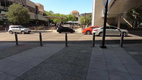 Time-lapse-traveling-down-an-escalator-to-the-crosswalk-at-Central-Avenue-leading-to-Patriots-Square-Park,-Phoenix,-Arizona