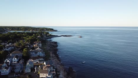 Aerial-drone-video-of-the-ocean-coastline-and-homes-at-Short-Sands-Beach-near-Cape-Neddick-and-York,-Maine,-United-States-of-America
