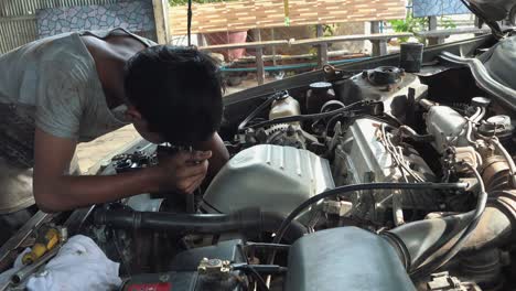Close-Shot-of-a-Mechanic-Fixing-a-Car