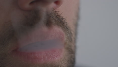 A-man-using-a-vape-pen-inhaling-nicotine-cannabis-or-flavoured-CBD