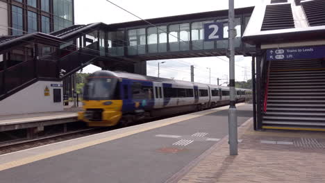 Northern-Train-Passing-Through-an-Empty-Commuter-Station-at-the-Weekend-in-Slow-Motion