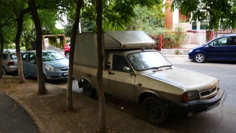 Panning-shot-of-An-old-Dacia-van-in-a-street-of-Galati,-Romania