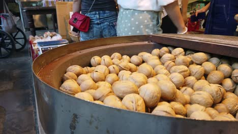 Xian,-China---July-2019-:-Walnuts-for-sale-on-a-stall-in-Muslim-Quarter-in-Xian-town,-Shaanxi-Province,-central-China