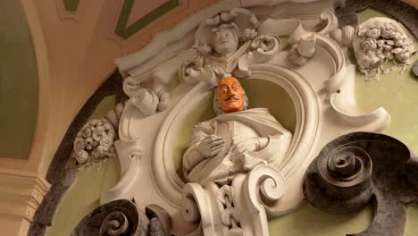 Low-Angle-View-Of-Orange-Faced-Statue-Of-Salvador-Dali-In-Naples,-Italy