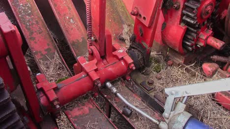 Greasing-the-finger-mechanism-on-an-old-small-square-baler