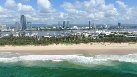 Beach-at-Gold-Coast-Spit-looking-over-towards-Broadwater,-Clear-summers-day,-Marina-yachts