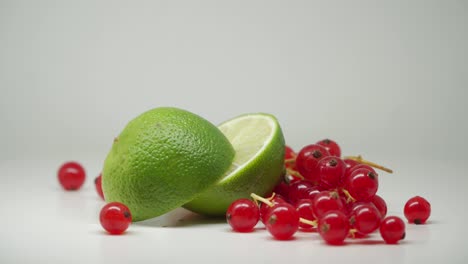Sweet-And-Delicious-Red-Currants-With-Slices-Of-Green-Limes---Close-Up-Shot