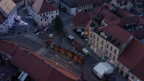 Deserted-Christmas-fair-in-small-town,-closed-shops-after-holiday,-aerial-view