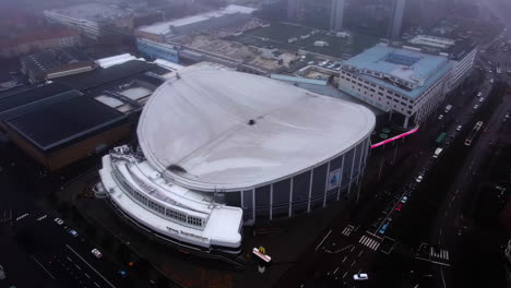 Aerial-arc-shot-of-Scandinavium-during-a-dark-and-gloomy-day-in-winter
