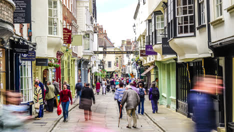 York,-Yorkshire,-United-Kingdom,-circa-:-Tourists-visiting-and-shopping-in-Stonegate-street-in-York,-UK