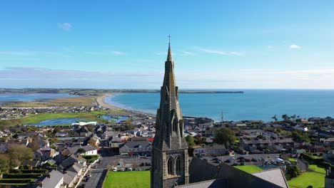 Aerial-dolly-over-Holy-Cross-Church-in-Waterford,-Ireland-during-sunny-day