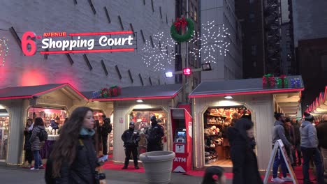 People-Shopping-at-6th-Ave-Shopping-Court-During-Christmas-Holiday-Time,-Families-Spending-Time-Together-During-Holiday-Season-And-Buying-Gifts