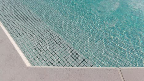 Swimming-pool-with-ripple-on-the-water-surface-on-a-sunny-day-in-slow-motion