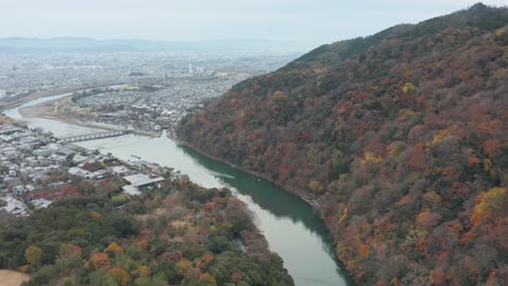 An-aerial-view-of-Kyoto,-Japan-from-above-Arashiyama's-Katsura-River