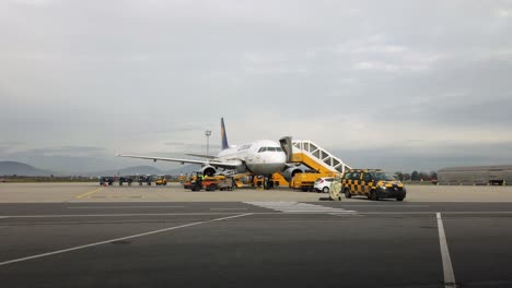 Lufthansa-aircraft-on-terminal-tarmac-is-prepared-for-next-flight