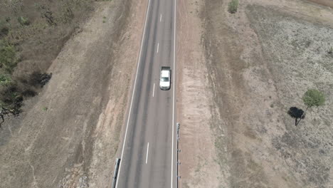 Aerial-drone-shot-of-road-in-Northern-Territory,-Australian-Outback