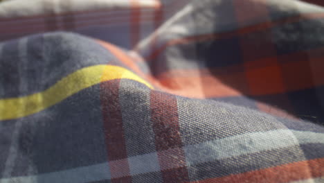 Close-up-over-a-plaid-patterned-cotton-shirt