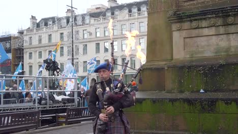 A-slow-motion-and-close-up-of-a-piper-playing-music-while-fire-comes-out-his-pipes