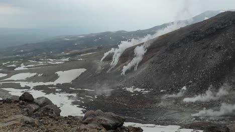 Smoke-emerges-from-slopes-of-active-stratovolcano-Asahi-Dake-in-Japan,-static