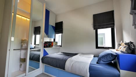 Decoración-De-Dormitorio-Moderno-Azul-Y-Gris-Con-Cama-Individual