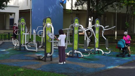Multi-generation-group-at-a-fitness-corner,-open-air-exercise-at-HDB-estate