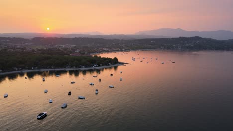 Aerial-View-of-Sunset-Above-Soto-City-Waterfront-on-Garda-Lake,-Lombardy,-Italy