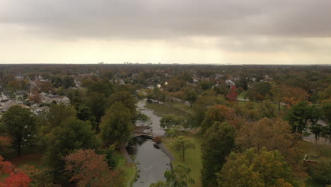A-high-aerial-shot-over-a-pond-on-a-cloudy-day
