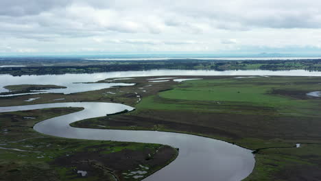 AERIAL-Winding-River,-Internationally-Important-Wetlands-And-Lake