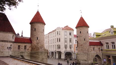 Twin-towers-of-Viru-Gate-in-the-old-town-of-Tallinn,-Estonia
