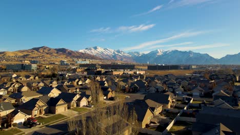 Low-altitude-flight-over-a-suburban-neighborhood-towards-Silicon-Slope-in-Lehi,-Utah
