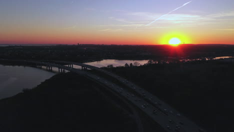 An-aerial-view-over-a-parkway-during-sunset-with-a-drone-camera