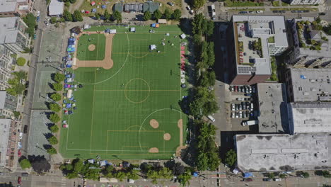 Seattle-Washington-Aerial-v127-vertical-shot-of-stadium-and-Cal-Anderson-Park-in-Capitol-Hill-neighborhood---June-2020