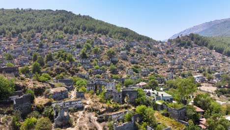 Drone-flight-close-up-over-the-ruins-of-an-ancient-fortress-located-in-the-green-mountain-hills-of-Turkey