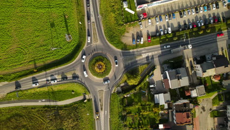 Roundabout-In-Poland-Aerial-Drone-Perspective-With-Traffic-during-sunny-day