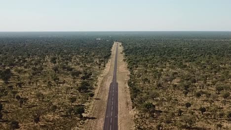 Aerial-View-Road-in-South-Africa-on-the-Savannah,-Kalahari-Nabib-Desert-the-Road-in-Rural-Botswana,-Africa
