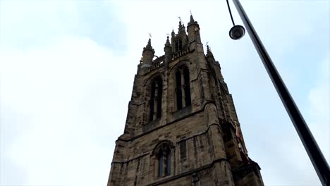 Glide-Video-of-an-old-English-Church-Tower-in-a-Cloudy-day